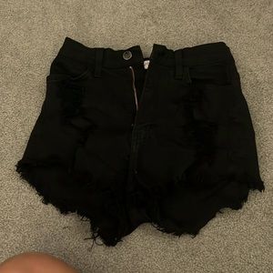 black shorts with holes in the front